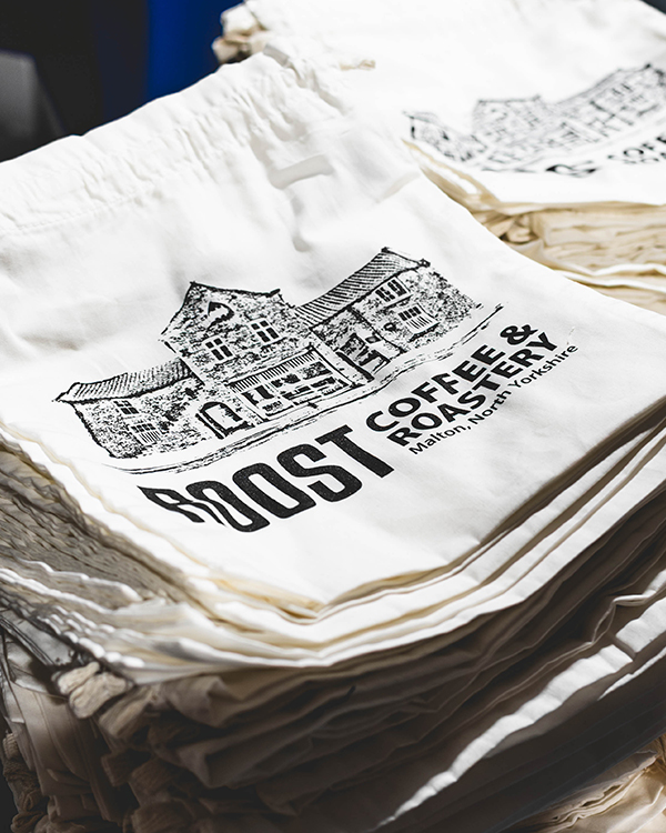 Stack of custom screen printed cotton tote bags