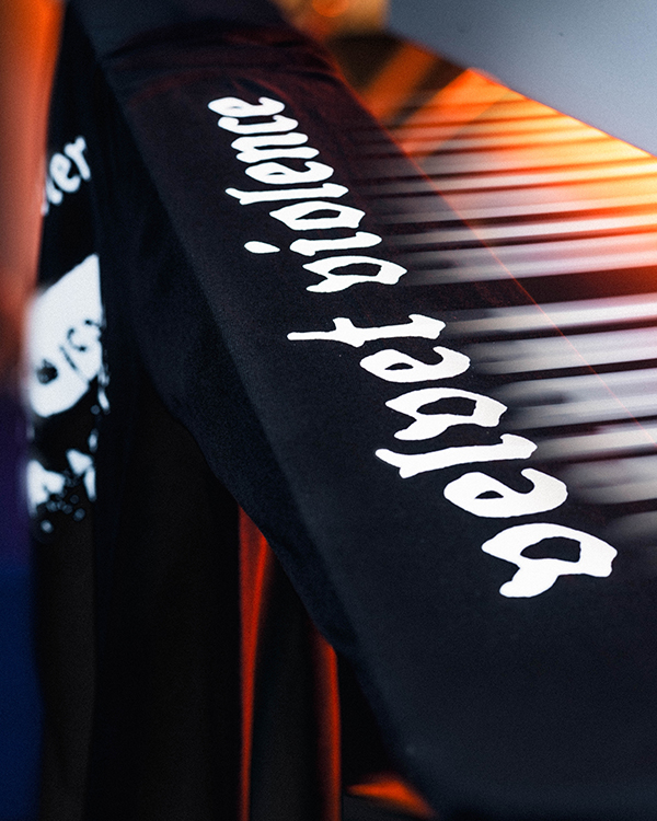 White sleeve print on black long sleeve band merchandise during production